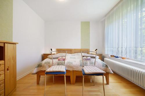 a dining room with a table and two chairs at Haus Grün in Templin