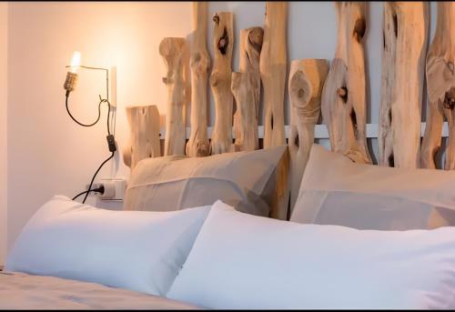 a bedroom with a bed with a wooden headboard at Villa Can Marsa in Santa Eularia des Riu