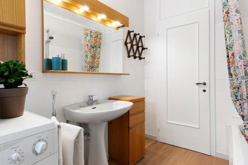 a bathroom with a sink and a mirror at The View in Levico Terme