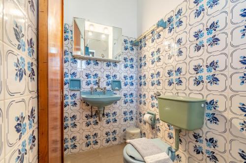 a bathroom with a toilet and a sink at Mires House Front Studio 1 in Agios Gordios