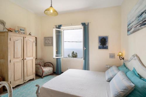 a bedroom with a bed and a window at Oasi in Alassio