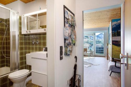 a bathroom with a toilet and a sink at Appartment Gute Zeit in Weiler-Simmerberg