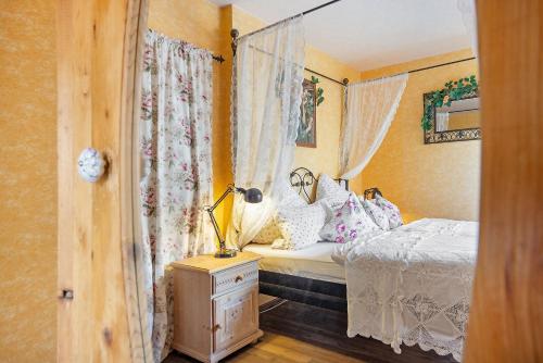 a bedroom with a bed and a lamp on a dresser at Comic Fantasy in Lindau