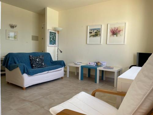 a living room with a couch and a table at Apartment Niceview in Alaior