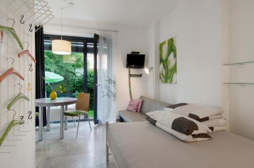 a living room with a couch and a table at Studio-in der atelierhaus Loft in Bodman-Ludwigshafen