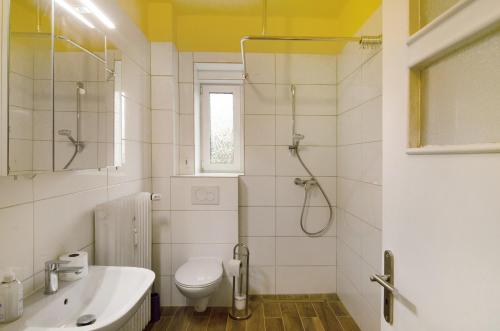 a bathroom with a shower and a toilet and a sink at Haus unterm Räuschenberg in Höxter