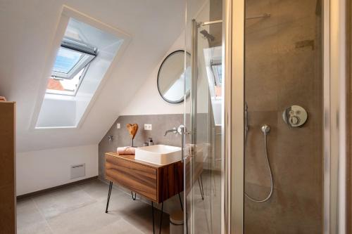 a bathroom with a sink and a shower at Ferienwohnung 6 in Bad Ditzenbach