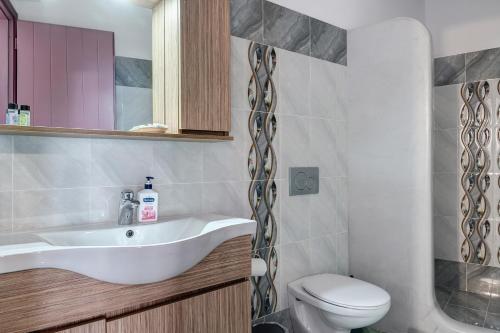 a bathroom with a sink and a toilet at Nicolas House 2 in Rakhídhion
