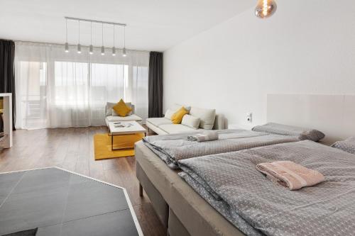 a living room with two beds and a couch at Ferienwohnung Sally in Lenzkirch