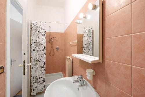a small bathroom with a sink and a shower at Dai Baccino in Celle Ligure
