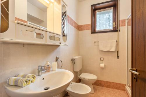a bathroom with a sink and a toilet at La Terrazza in Brunate
