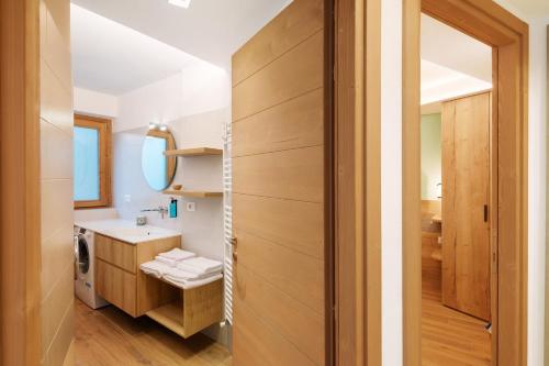 a bathroom with a toilet and a sink at Chalet Emma Isolaccia in Valdidentro