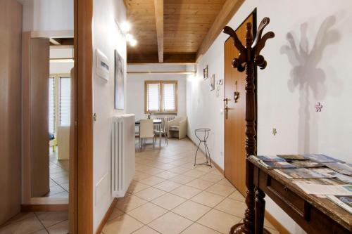 a hallway with a kitchen and a dining room at Casa Zia Dani in Piantedo