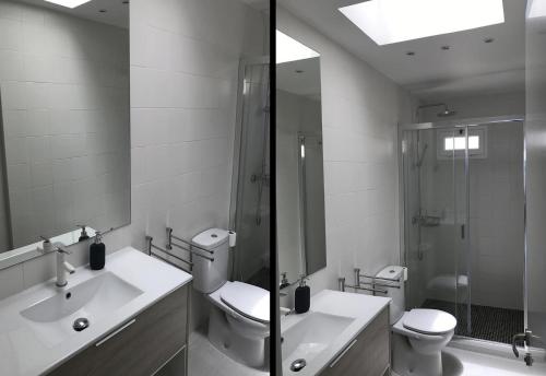 a bathroom with a toilet and a sink and a shower at Fabulous upper floor sea view in San Agustin