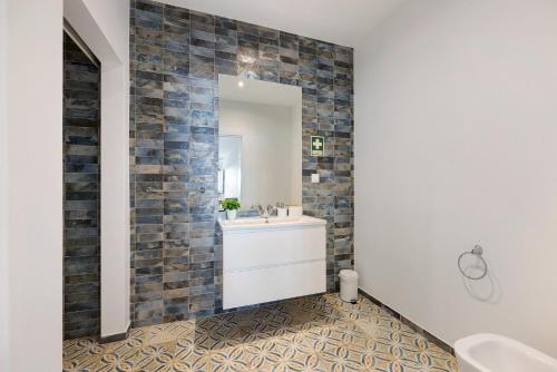 a bathroom with a sink and a mirror at Villa Xique 11 in Monchique