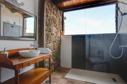 a bathroom with a sink and a glass shower at Estudio Pu in La Vegueta