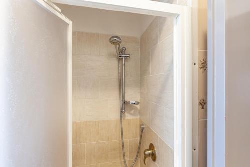 a bathroom with a shower with a glass door at Residence Caravel 9 in Lido di Camaiore