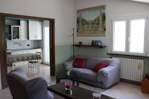 a living room with a couch and a table at Relax and apartment in SantʼAgata Feltria