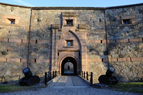 an entrance to a building with a stone wall at Oscarsborg Castle Hotel & Resort in Drøbak