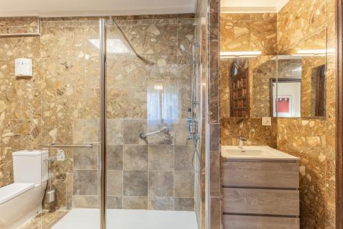 a bathroom with a shower and a sink at Casa Rural Las Yernas in La Serrada