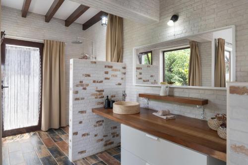 a bathroom with a sink and a mirror at Guenia ll in El Mojón