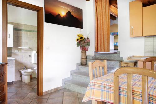 a kitchen with a staircase leading to a bathroom at Anemone Tano di Grich in Cesani