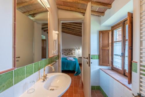 a bathroom with a sink and a mirror at Agriturismo la Taverna Di Celsa in Sovicille
