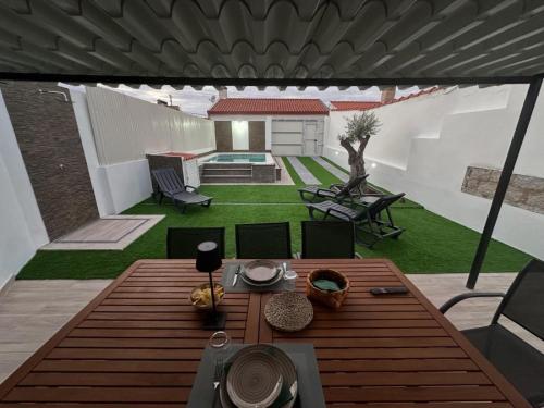 a view of a patio with a table and chairs at Casa dos Avós in Santa Eulália
