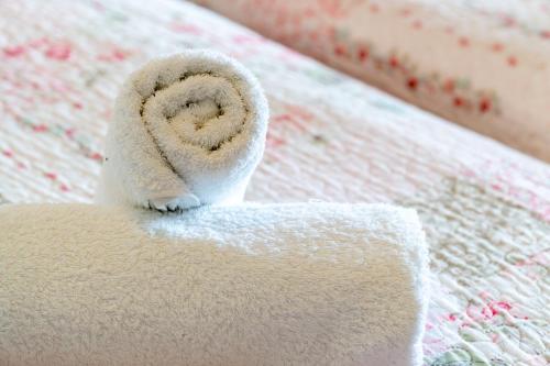 a towel on a bed with a towel at Arianna Studio Ground Floor 7 in Paleokastritsa