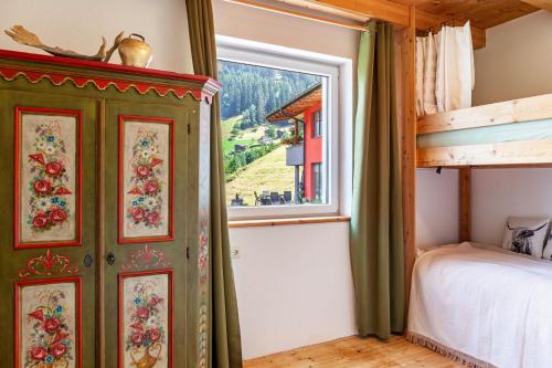 a bedroom with a bunk bed and a window at Maierhof 341 in See