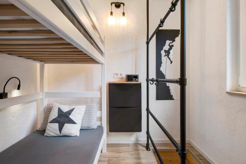 a room with a bed with a star pillow on it at Gutenburgturm 18qm auf 3 Etagen in Waldshut-Tiengen