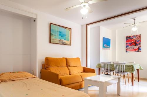 a living room with a couch and a table at Can Maryel in Tossa de Mar