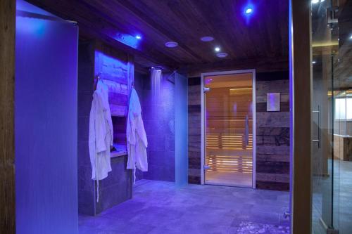 a hallway with purple lights in a building at Fedaia Joy Bnb in Canazei
