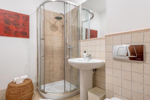 a bathroom with a shower and a sink at Villa Can Got in Sóller