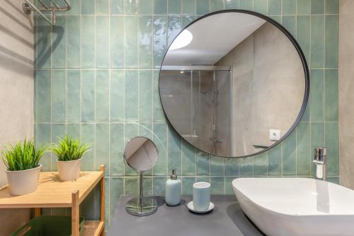 a bathroom with a sink and a mirror at Arizona's Bay in Puerto Rico de Gran Canaria