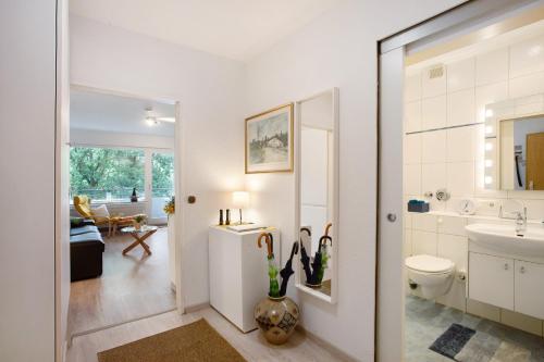 a bathroom with a sink and a toilet at Ferienwohnung Rübezahl in Brilon