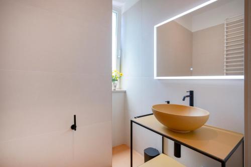 a bathroom with a bowl sink on a counter at Villa Capobianco in Polignano a Mare