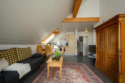 a living room with a couch and a table at Ferienwohnung Mara in Öhningen