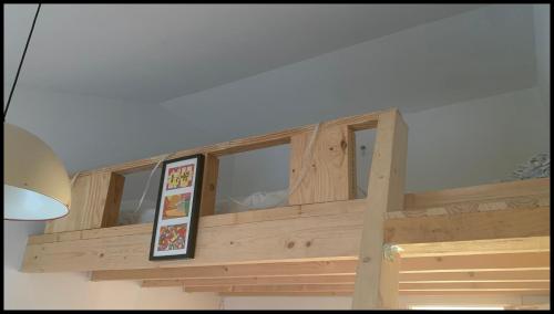 a wooden balcony with a framed picture on it at Sítio Do Valverde in Coruche
