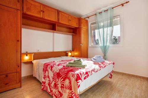 a bedroom with a bed and a window at Los Tinajones in La Oliva