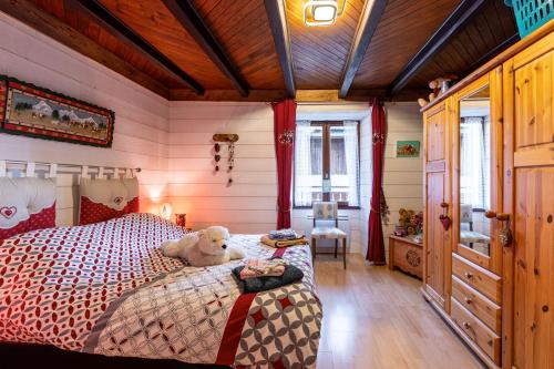 Llit o llits en una habitació de Aux 4 saisons