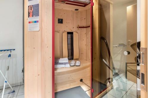 a wooden room with a pair of shoes in it at Ferienwohnung Griesbaum in Tengen
