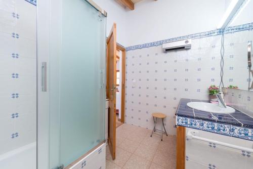 a bathroom with a sink and a counter top at Can Baixo in Port de Soller