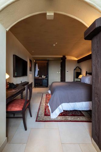 Giường trong phòng chung tại Hôtel Fantaisie