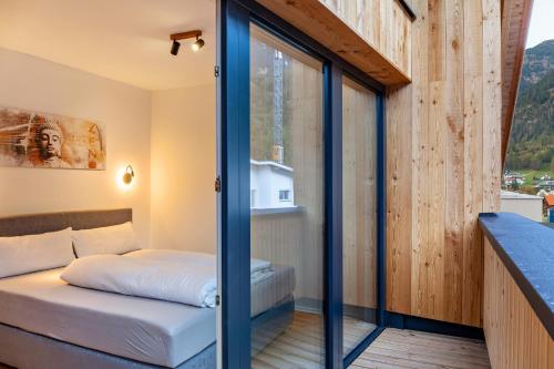 a room with a bed and a window at Apartement Bens Auszeit Top 6 in Umhausen