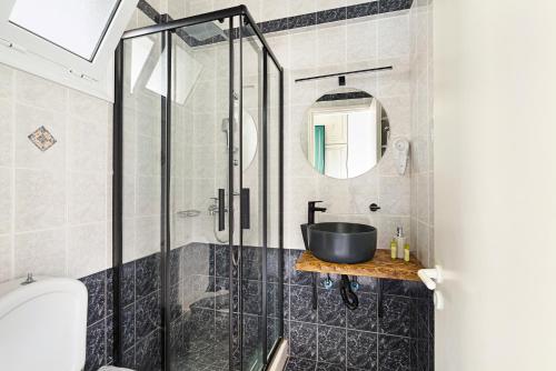 a bathroom with a sink and a shower at Sunset Premium Studio D in Lefkada