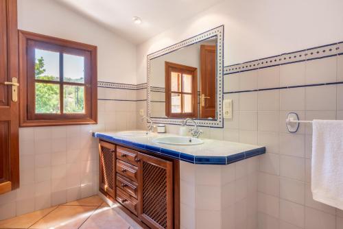 a bathroom with a sink and a mirror at Son Xigala in Manacor