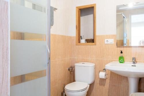a bathroom with a toilet and a sink at Ainara Luxury in Lloret de Mar