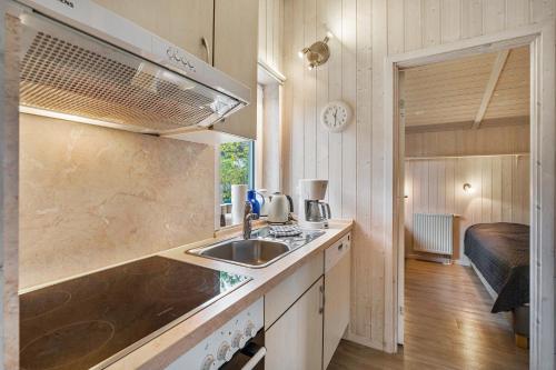 a kitchen with a sink and a counter top at Skipper-Lodge West in Kosel