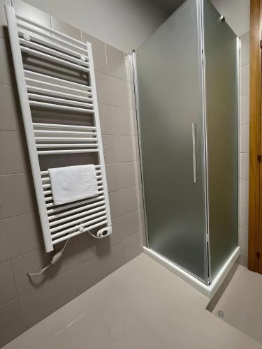 a shower with a glass door in a bathroom at Dimora Vibo Centro in Vibo Valentia